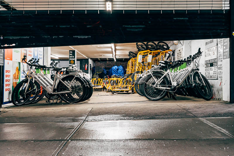E-bikes and cargo trailers stored in a garage near Union Square