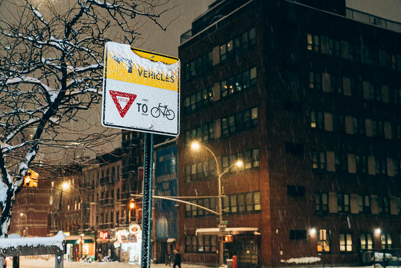 A traffic sign in Manhattan stating that cars must yield to bikes